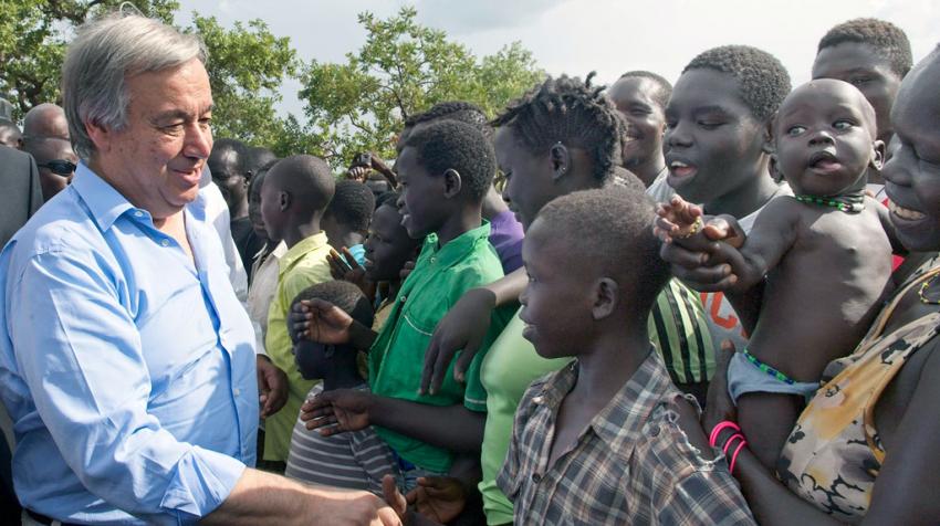 UN Secretary-General António Guterres greets refugee families during a visit to Imvepi Refugee Settlement in Arua District, northern Uganda, in June 2017. The visit drew global attention to Uganda’s open-door refugee policy and the significant social, economic, and health-system pressures borne by host communities and national services in responding to large-scale displacement. UN Photo/Mark Garten. Makerere University School of Public Health Communications Office, Graduation Profiles Series, 76th Graduation Ceremony, Dr. Henry Komakech, “Effects of the Repatriation of Refugees on the Health Services of the Host Populations in the West Nile Districts of Arua, Moyo, and Adjumani,” Kampala Uganda, East Africa.