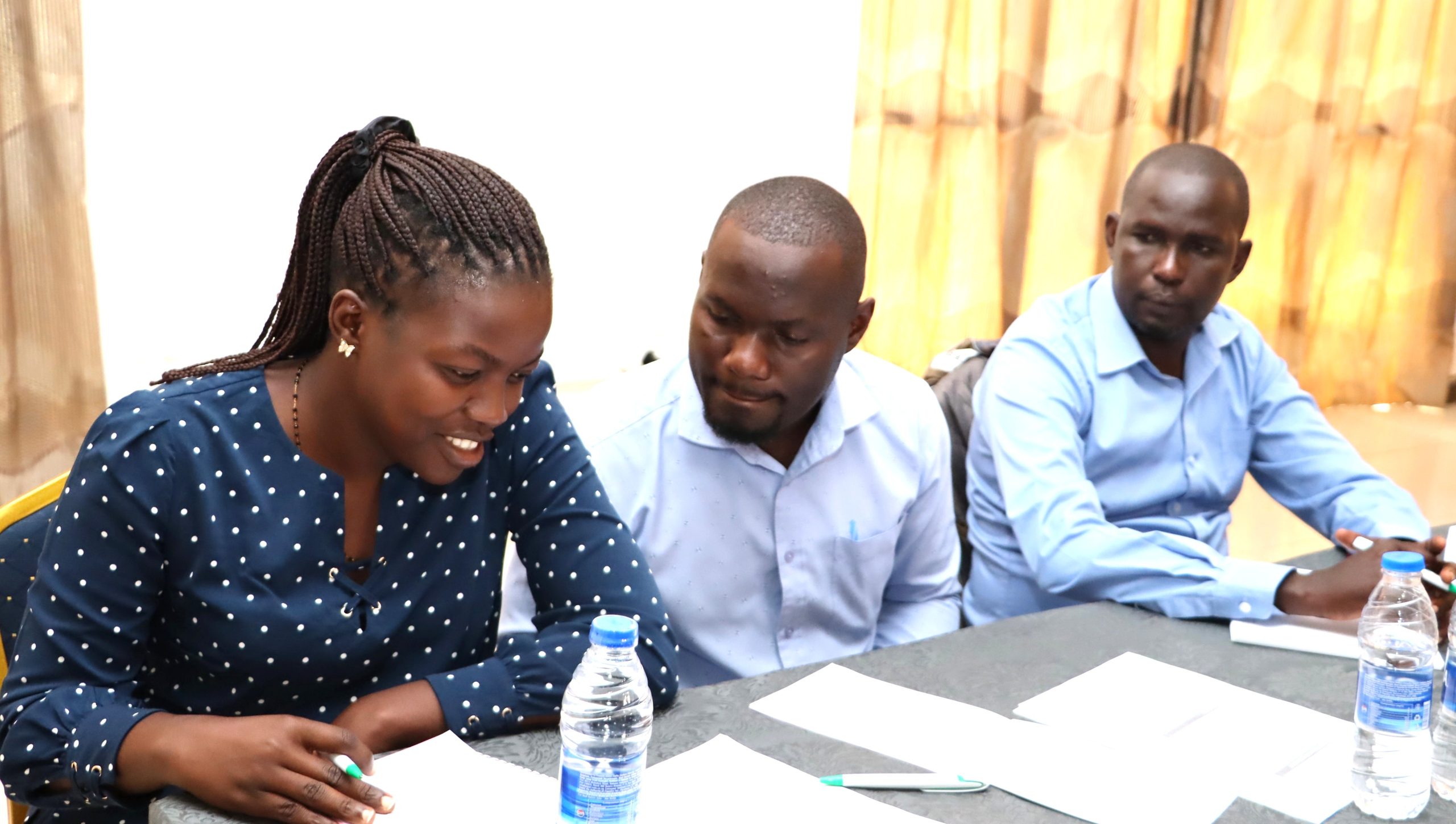 Some officials confer during group work. Environment for Development (EfD) Uganda, College of Business and Management Sciences (CoBAMS) capacity-building initiative to equip local government officers with practical tools to better manage natural resources amid growing environmental pressures funded by the Government of Uganda through the Makerere University Research and Innovation Fund (Mak-RIF), 26th March 2026, Soroti, Uganda, East Africa.