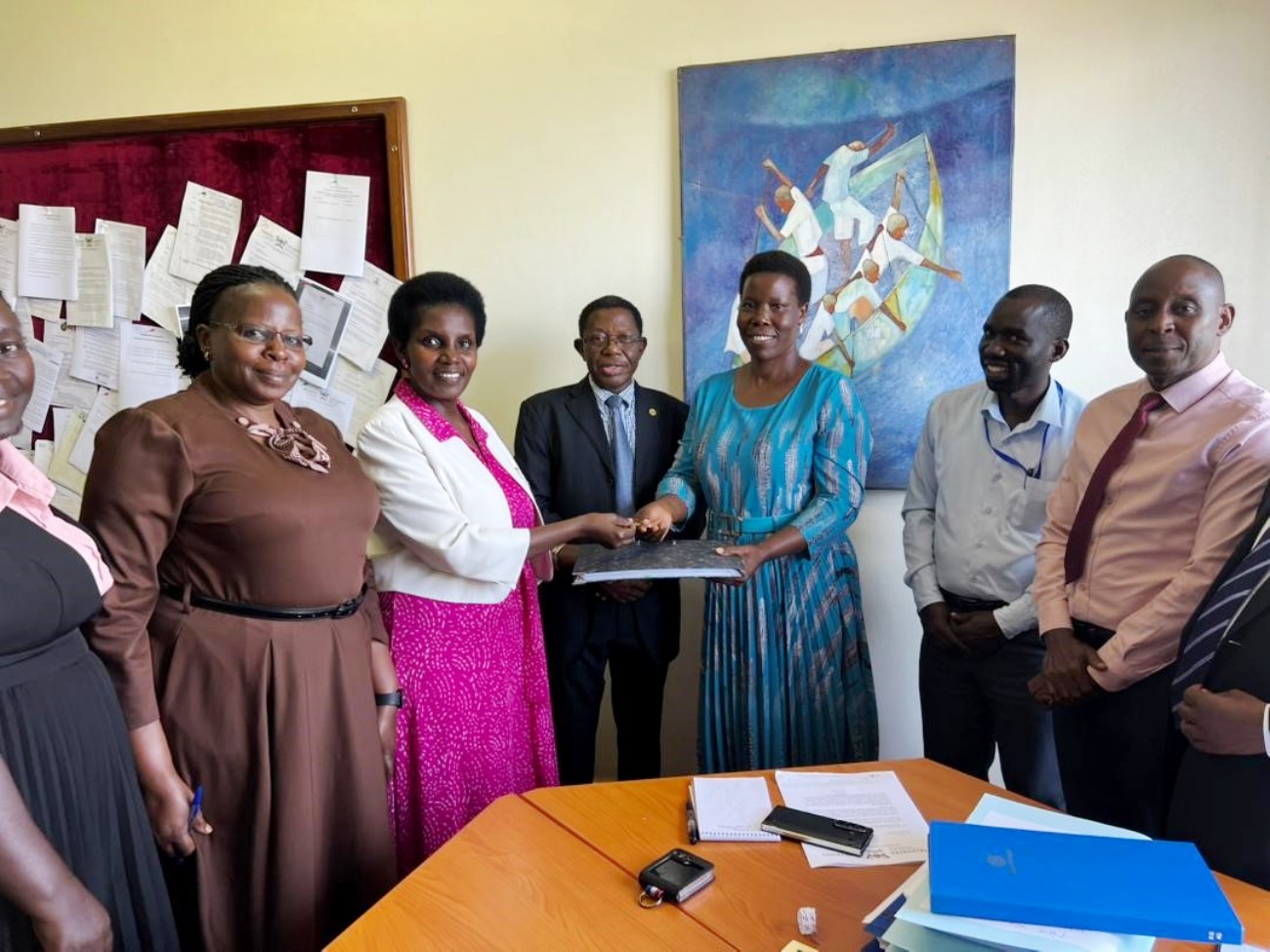 Academic Registrar, Prof. Buyinza Mukadasi and his Senior Management Team (SMT) witness the official handover of office of Deputy Academic Registrar in charge of the Senate Division, from Mrs. Patience Mushengyezi to Ms. Gladys Khamili, who assumes the role in an acting capacity, 20th April 2026, Senate Building, Makerere University, Kampala Uganda, East Africa.