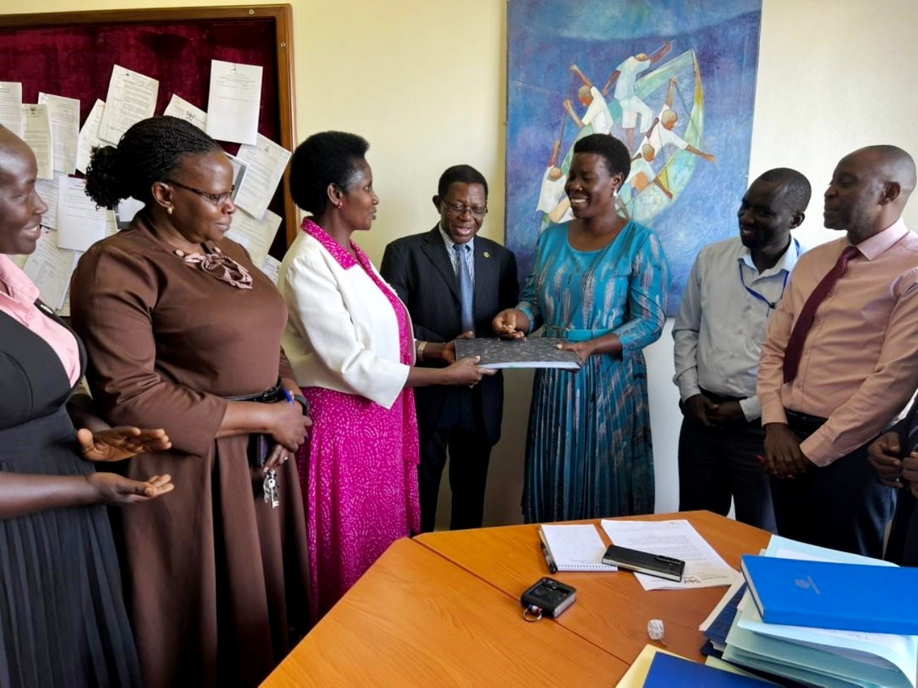 Academic Registrar, Prof. Buyinza Mukadasi and his Senior Management Team (SMT) witness the official handover of office of Deputy Academic Registrar in charge of the Senate Division, from Mrs. Patience Mushengyezi to Ms. Gladys Khamili, who assumes the role in an acting capacity, 20th April 2026, Senate Building, Makerere University, Kampala Uganda, East Africa.