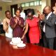 Ruth Asiimwe (in Red dress) cuts the cake in honor of her departure on 16th April 2026. Environment for Development (EfD) Centre bids farewell to third intern, Ruth Asiimwe, who secured a position with the African Development Bank in Juba South Sudan, 16th April 2026, Yusuf Lule Central Teaching Facility, Makerere University, Kampala Uganda, East Africa.