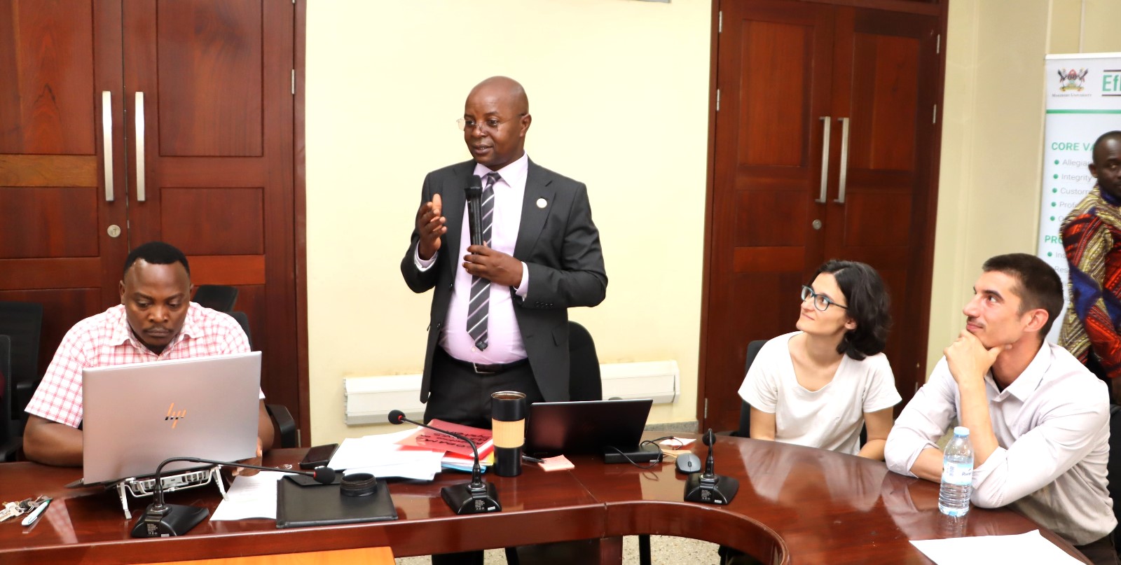 Prof. Edward Bbaale appreciating Ms. Ruth Asiimwe as visiting Prof. Nathalie and colleague listen. Environment for Development (EfD) Centre bids farewell to third intern, Ruth Asiimwe, who secured a position with the African Development Bank in Juba South Sudan, 16th April 2026, Yusuf Lule Central Teaching Facility, Makerere University, Kampala Uganda, East Africa.