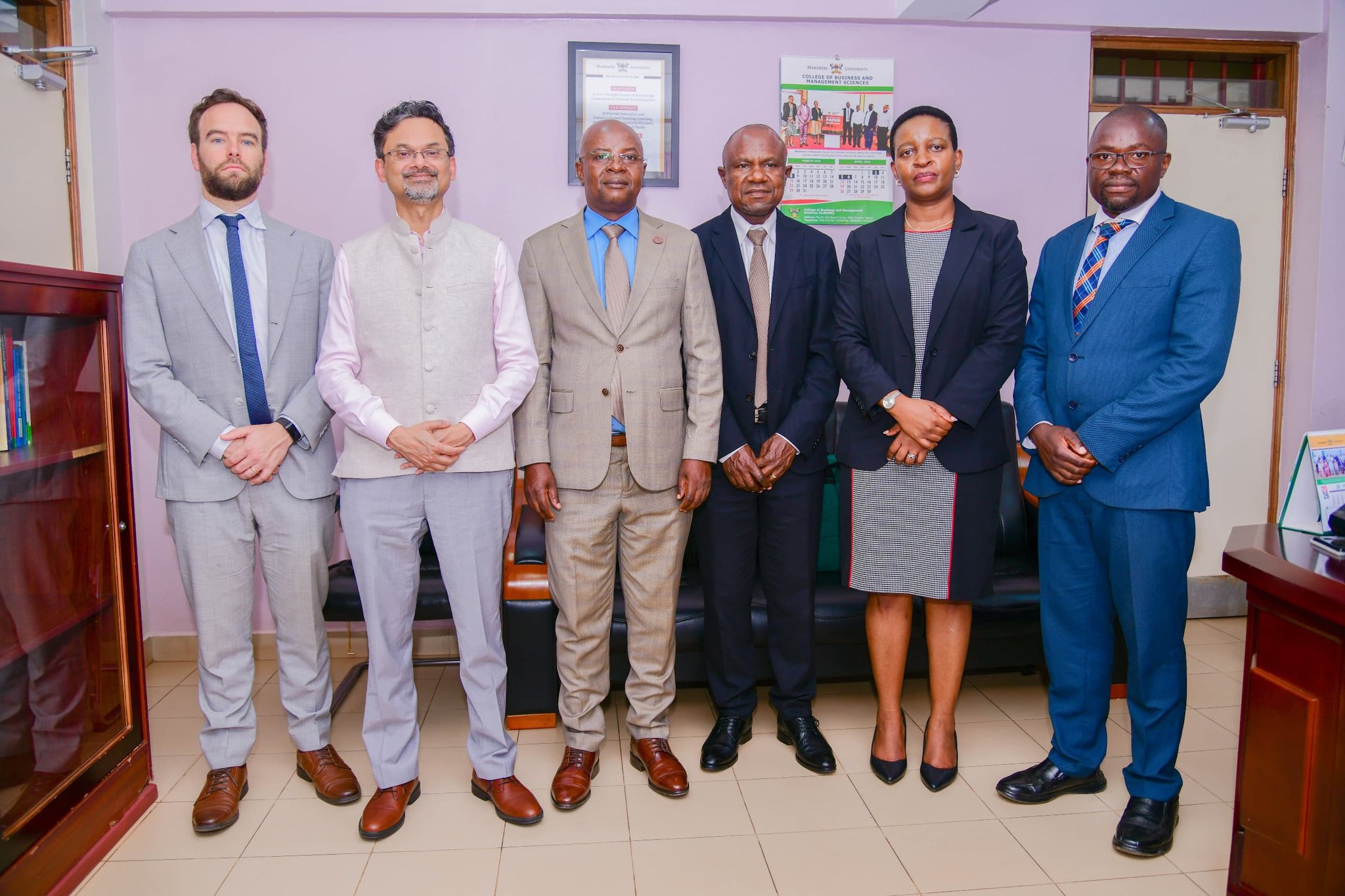 L-R: Cyril Desponts, Hassan Zamani, Prof. Edward Bbaale, Assoc. Prof. Eria Hisali, Liz Mukasa Samula, and Assoc. Prof. Ibrahim Mike Okumu. Strategic partnership engagement with delegation from the World Bank ahead of the African Meeting of the Econometric Society scheduled to take place in June 2027 preceded by the Econometric Society Summer School, 1st April 2026, Office of the Principal, College of Business and Management Sciences (CoBAMS), Makerere University, Kampala Uganda, East Africa.