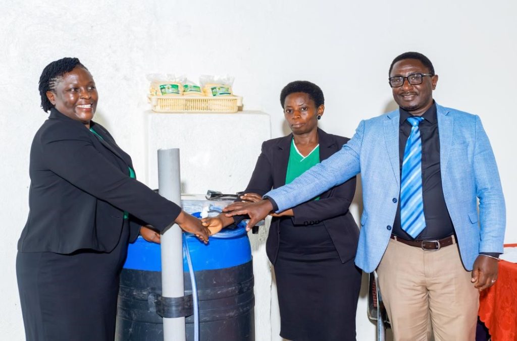 The Principal Investigator and Resident City Commissioner Mbarara City, awarding Ms. Catherine Kiconco, one of the project team members a portable biogas system. Department of Plant Sciences, Microbiology and Biotechnology, College of Natural Sciences (CoNAS), Makerere University, Kampala, project “Bio-innovation of biogas, biofertilizer, and biopesticide through the utilization of bio-waste” to promote transformation of household food waste into biogas and other valuable bio-products, dissemination of research findings to stakeholders in Mbarara City, 15th April 2026, Uganda, East Africa.