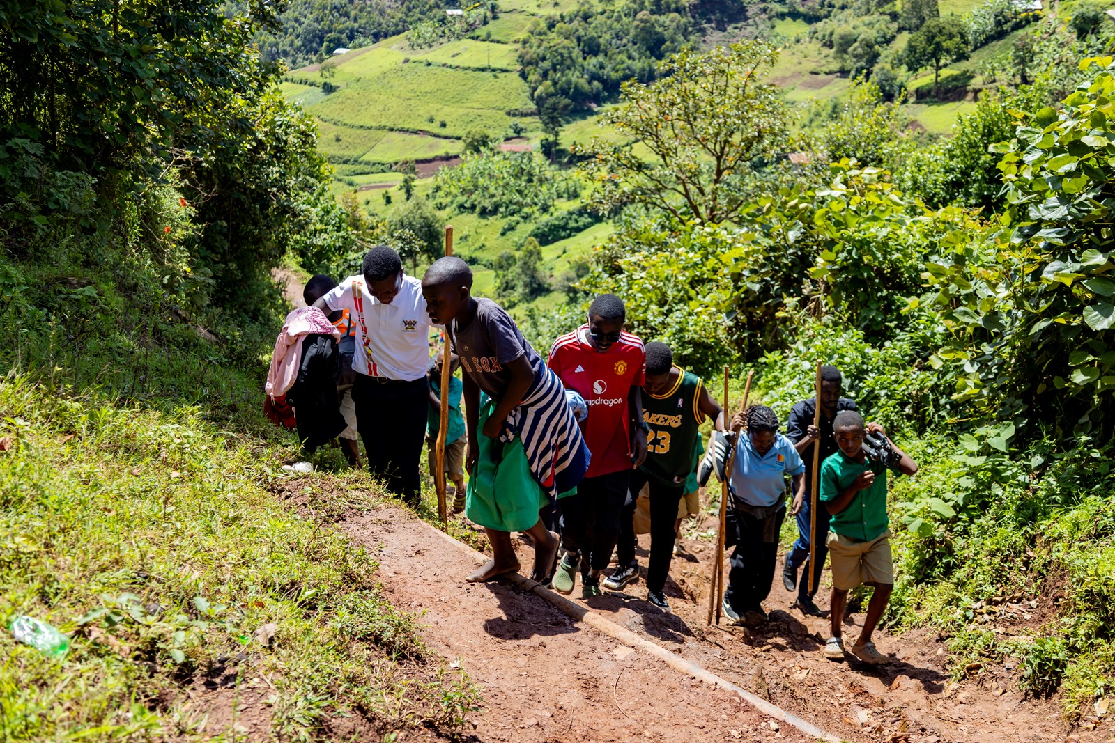 The access to Bwera Primary School. Mastercard Foundation Scholars Program at Makerere University Giveback, in partnership with dfcu Bank, handover five-classroom block equipped with 60 bench desks, four-stance modern pit latrine, and a 10,000-litre rainwater harvesting system on 1st April 2026 to Bwera Primary School in Kabale District, Uganda, East Africa.