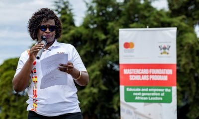 Ms. Jolly Okumu speaks at the Mastercard Foundation Scholars Program at Makerere University Giveback to Bwera Primary School, Kabale in partnership with dfcu Bank on 1st April 2026. Mastercard Foundation Scholars Program at Makerere University Giveback, in partnership with dfcu Bank, handover five-classroom block equipped with 60 bench desks, four-stance modern pit latrine, and a 10,000-litre rainwater harvesting system on 1st April 2026 to Bwera Primary School in Kabale District, Uganda, East Africa.