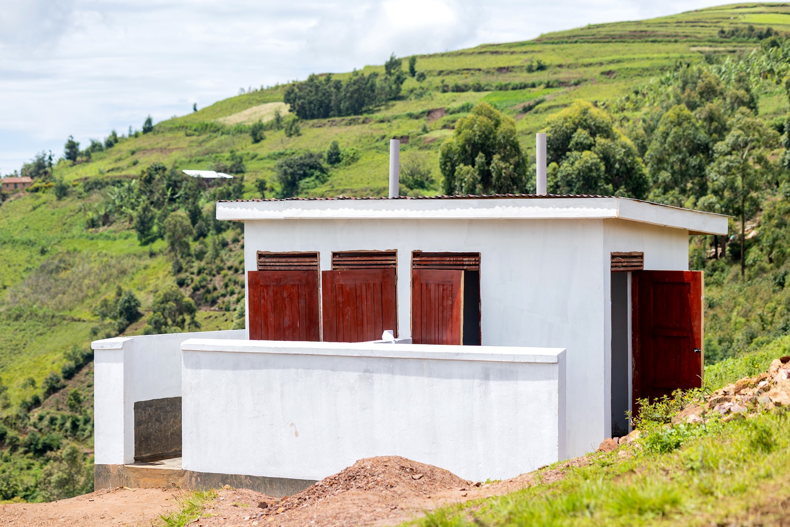 The four-stance modern pit latrine. Mastercard Foundation Scholars Program at Makerere University Giveback, in partnership with dfcu Bank, handover five-classroom block equipped with 60 bench desks, four-stance modern pit latrine, and a 10,000-litre rainwater harvesting system on 1st April 2026 to Bwera Primary School in Kabale District, Uganda, East Africa.