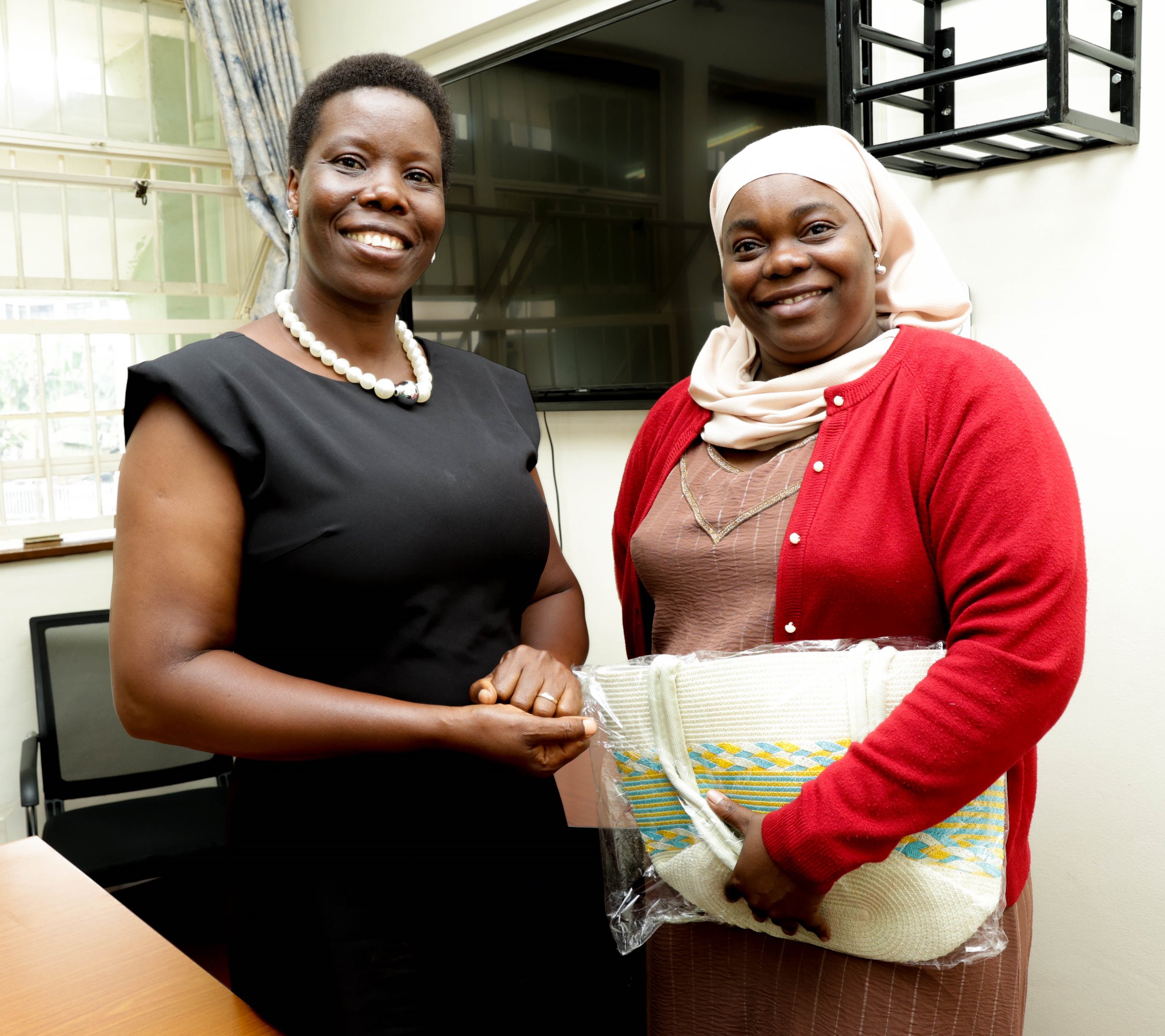 Ms. Gladys Khamili hands over to Ms. Annet Khabuya after 12 years of service as Registrar and transitions to senior role Deputy Registrar, Senate Division, Office of the Academic Registrar during the Makerere University School of Public Health (MakSPH) 239th Management Meeting, 15th April 2026, Mulago Campus, Kampala Uganda, East Africa.