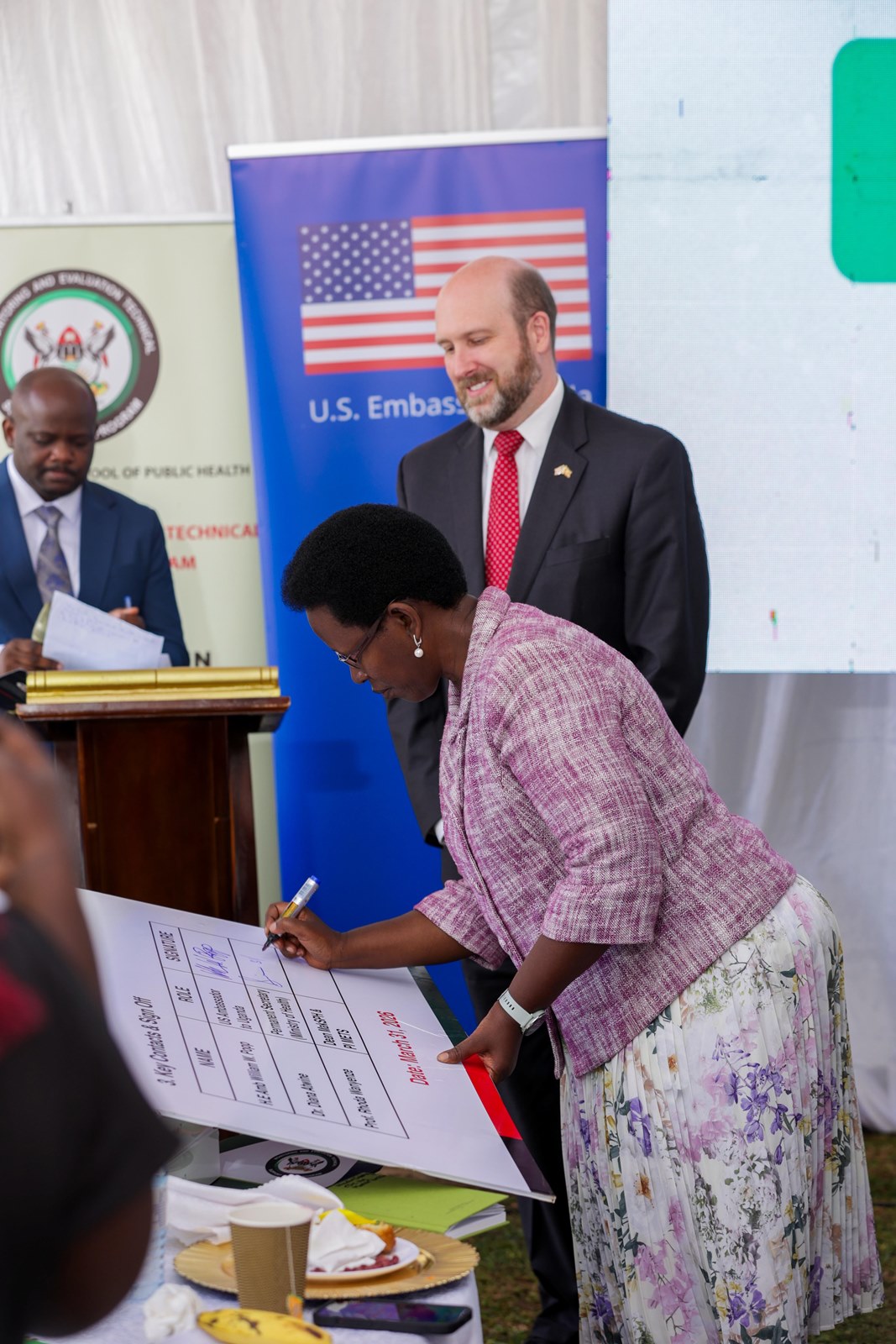 Dr. Diana Atwine, the Permanent Secretary signs to receive the digital health systems and assets. Transition of Uganda’s digital health systems and assets built over 15 years through the Makerere University School of Public Health Monitoring and Evaluation Technical Support (MakSPH-METS) Program with funding from the U.S. Government to the Ministry of Health (MoH), 31st March 2026, MoH Headquarters, Kampala Uganda, East Africa.
