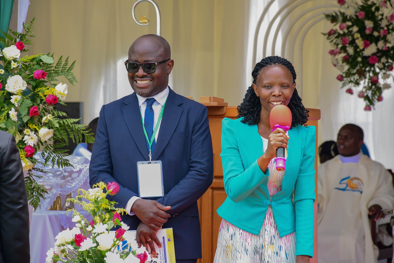 Some of the celebration officials Simon Kaggwa Njala (L) and Ritah Namisango (R). Marking 85 years of St. Augustine Chapel under the theme, “Our hearts are restless until they rest in you, O Lord,” thanksgiving Mass led by His Grace, Paul Ssemogerere, Archbishop of the Roman Catholic Archdiocese of Kampala, and Chief Guest as Vice President H.E. Maj. (Rtd)  Jessica Alupo, April 12, 2026, Freedom Square, Makerere University, Kampala Uganda, East Africa.
