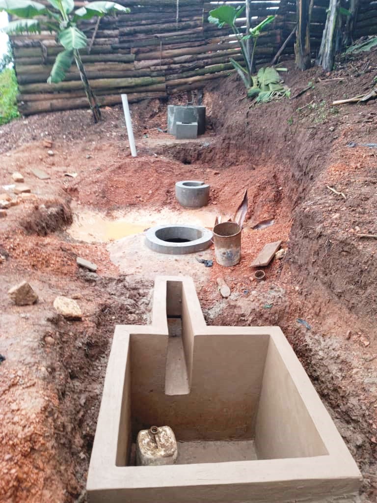 Biogas system under construction. Towards a Clean Energy and Zero-Emission Society in East Africa: Strengthening Academic and Community Collaboration in Outreach, Training, and Research for Green Growth and a Healthy Environment (TORCH) Project Living Lab model project monitoring and progress review meeting, 27 April 2026 in Kabale Uganda, East Africa with participantion from Makerere University, BOKU University (Austria), Kabale University, Youth Go-Green, as well as students, researchers, farmers, and community leaders.