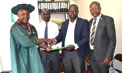 Prof. Michael Owor (L) handing over to Prof. David Ssevviiri. Second left is Makerere University Chief of Internal Audit, Mr Patrick Akonyet and on the right is Prof. Juma Kasozi, Deputy Principal, CoNAS. Prof. Michael Owor officially hands over office of Dean, School of Physical Sciences to Prof. David Ssevviiri for the next four years, effective 6th May 2026, on 28th May 2026, College of Natural Sciences (CoNAS), Makerere University, Kampala Uganda, East Africa.