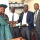 Prof. Michael Owor (L) handing over to Prof. David Ssevviiri. Second left is Makerere University Chief of Internal Audit, Mr Patrick Akonyet and on the right is Prof. Juma Kasozi, Deputy Principal, CoNAS. Prof. Michael Owor officially hands over office of Dean, School of Physical Sciences to Prof. David Ssevviiri for the next four years, effective 6th May 2026, on 28th May 2026, College of Natural Sciences (CoNAS), Makerere University, Kampala Uganda, East Africa.
