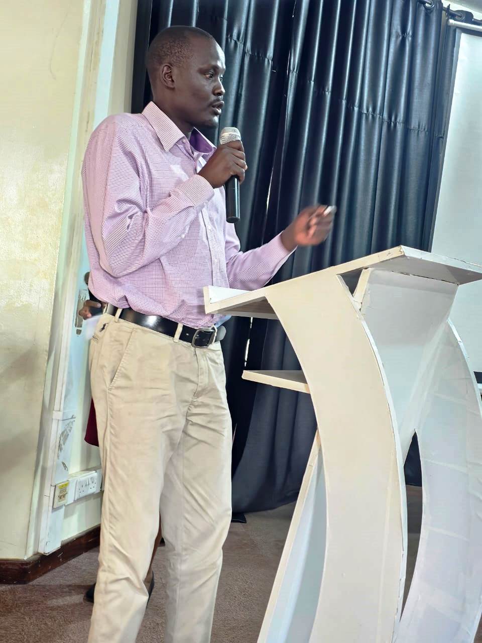 The Outgoing PhD President. Directorate of Graduate Training orientation of PhD Cohort 11 (2025/2026) presided over by Academic Registrar, Prof. Buyinza Mukadasi, April, 2026, School of Food Technology, Nutrition and Bioengineering Conference Hall, CAES, Makerere University, Kampala Uganda, East Africa.