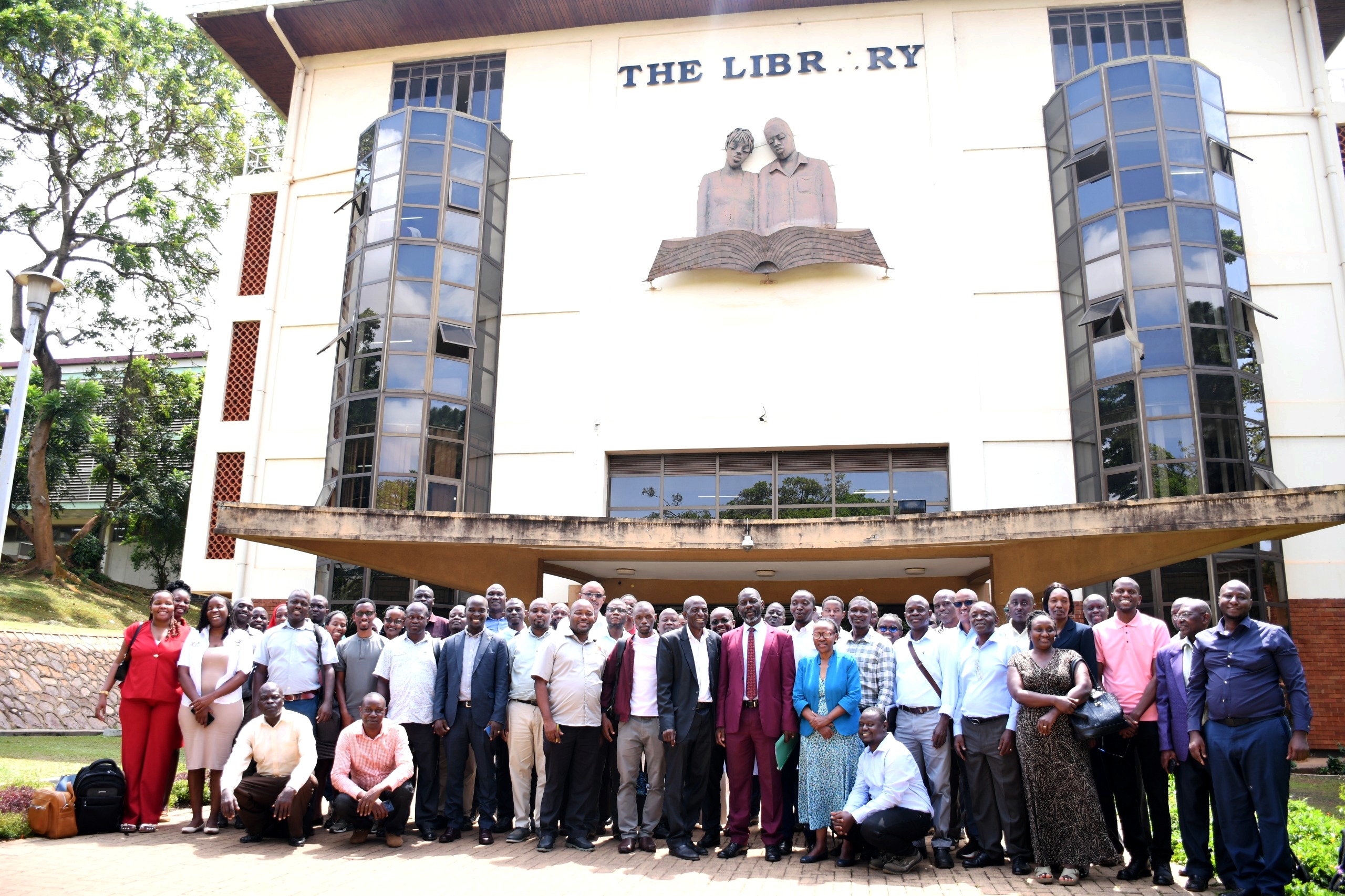 Prof. Julius Kikooma and Prof. Stella Neema pose for a group photo outside the Main Library with facilitators and PhD students after the training on 25th May 2025. Closure of a 10-day PhD cross-cutting training in Advanced Research Methods organized by the Directorate of Graduate Training and supported by iCARTA as part of efforts to strengthen doctoral education and research capacity, 25th May 2026, Main Library Room 24/7, Makerere University, Kampala Uganda, East Africa.
