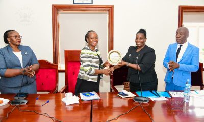 Prof. Helen Nambalirwa Nkabala (2nd R) receives a plaque on behalf Prof. Winston Tumps Ireeta from Prof. Sarah Ssali (2nd L) as Prof. Henry Alinaitwe (R) and CPA Agnes Khwaka (L) witness on 4th May 2026. Handover of Office of Deputy Vice Chancellor (Finance and Administration)-DVCFA from Prof. Winston Tumps Ireeta to Prof. Henry Alinaitwe, 4th May 2026, Council Room, Main Building, Makerere University, Kampala Uganda, East Africa.