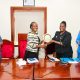 Prof. Helen Nambalirwa Nkabala (2nd R) receives a plaque on behalf Prof. Winston Tumps Ireeta from Prof. Sarah Ssali (2nd L) as Prof. Henry Alinaitwe (R) and CPA Agnes Khwaka (L) witness on 4th May 2026. Handover of Office of Deputy Vice Chancellor (Finance and Administration)-DVCFA from Prof. Winston Tumps Ireeta to Prof. Henry Alinaitwe, 4th May 2026, Council Room, Main Building, Makerere University, Kampala Uganda, East Africa.