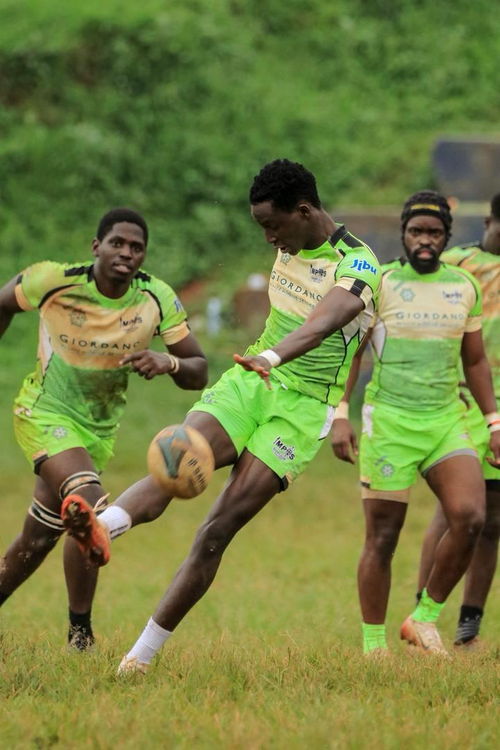 Darren Aine kicks into the opposition as Henry Nsekuye (R) and other players get ready to give chase. From the Graveyard to the Semi-Finals: The Remarkable Rise of Makerere University's Impis Rugby Club, Kampala Uganda, East Africa.