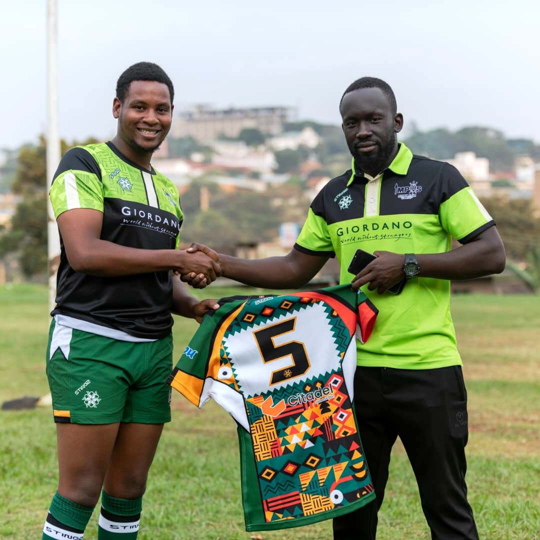 Head Coach Nkamba Alvin with one of the players. From the Graveyard to the Semi-Finals: The Remarkable Rise of Makerere University's Impis Rugby Club, Kampala Uganda, East Africa.