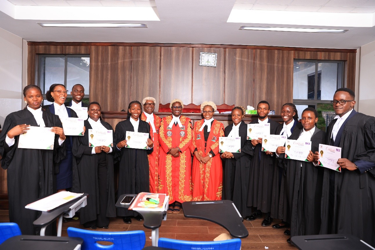 The Amicus team who were recognised as the winning team with the presiding judges. Public Interest Law (PILAC) 13th Clinical Legal Education (CLE) Moot presided over by a panel of three High Court Judges: Hon. Lady Justice Jane Okuo Kajuga, Hon. Justice Isa Serunkuma and Hon. Lady Justice Alice Komuhangi Khaukha, 14th May 2026, in the Makerere University School of Law (SoL) Moot Court Room, Kampala Uganda, East Africa.