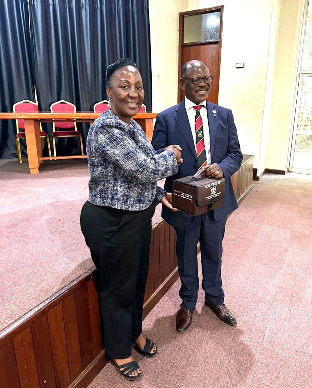 Prof. Gorettie Nabanoga handing over the CAES soil test kit to the Vice Chancellor. Management strategic engagement with staff at the College of Agricultural and Environmental Sciences (CAES), 11 May 2026, Conference Hall, School of Food Technology, Nutrition and Bioengineering, Makerere University, Kampala Uganda.
