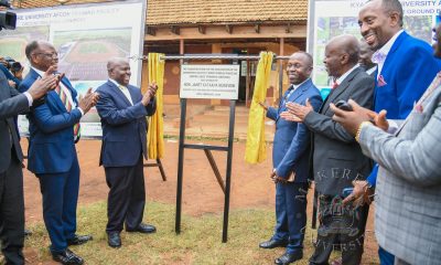 Hon. Peter Ogwang unveils the foundation stone for the AFCON 2027 Training Grounds at Makerere University on behalf of Hon. Janet Kataaha Museveni as Hon. Dr. Crispus Kiyonga (2nd L), Prof. Barnabas Nawangwe (L) and other officials witness on 19th February 2027. Groundbreaking ceremony for the AFCON 2027 training facilities at Makerere University and commissioning of six construction sites in Hoima, Masindi, Kyambogo University, Lira University, and Gulu University, 19th February 2026, Main Sports Grounds, Kampala Uganda, East Africa.