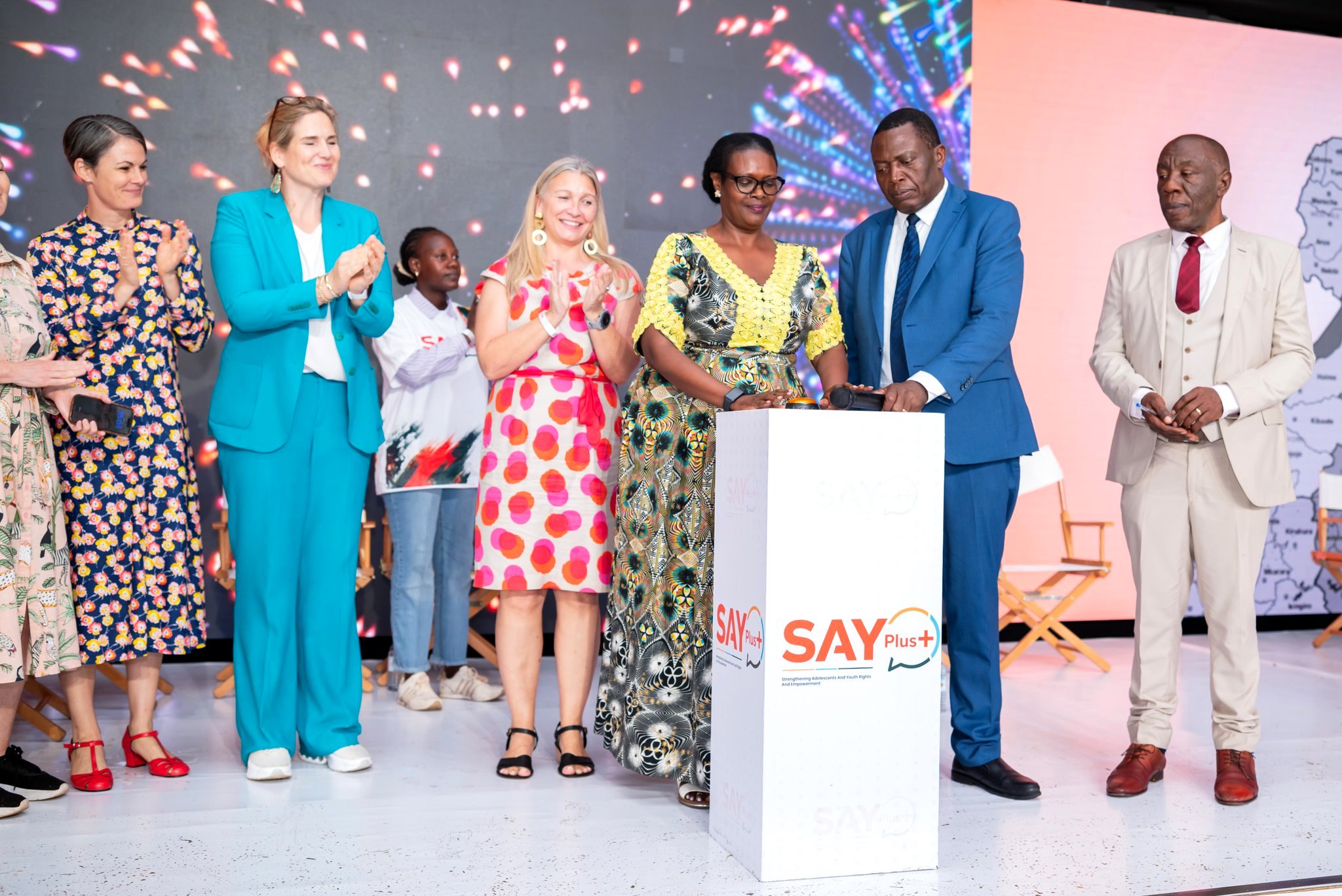 Hon. Margaret Muhanga assisted by Dr. Charles Olaro officially launches the SAY Plus+ Programme as L-R: Amb. Signe Winding Albjerg, Amb. Frederieke Quispel, Ms. Kristine Blokhus and Prof. Henry Alinaitwe witness. The Government of Uganda, through the Ministry of Health officially launches the SAY Plus+ Programme, a Sexual and Reproductive Health and Rights (SRHR) initiative designed to strengthen adolescent and youth rights, empowerment, protection and access to quality services in Uganda's underserved regions, Backed by a USD 50 million pooled fund from the Governments of Iceland, Denmark, the Netherlands, and Sweden, scheduled to operate between 2024 and 2030. 7th May 2026, Freedom Square, Makerere University, Kampala Uganda, East Africa.