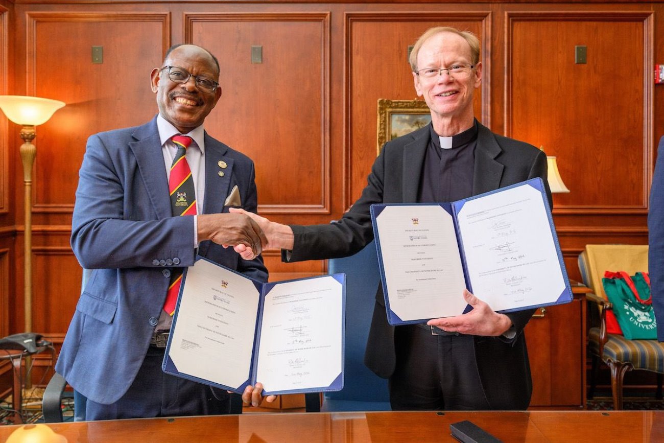 The Vice Chancellor, Prof. Barnabas Nawangwe (L) and the ND 18th President, Rev. Robert A. Dowd shake hands after signing the MoU. Makerere University Kampala, Uganda and the University of Notre Dame, South Bend, Indiana, USA (ND) sign MOU, which opens opportunities for collaboration between the two historic and leading research institutions in the areas of staff and student exchange, joint research and training, joint supervision of graduate students, and others, May 2026.