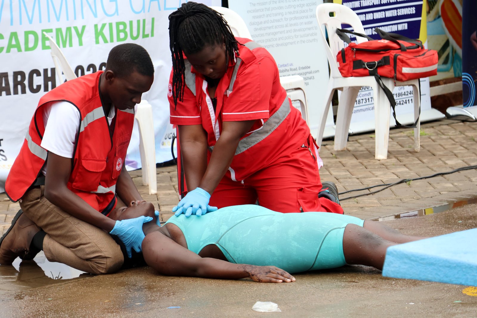 Demonstration of emergency medical procedures performed by the Uganda Red Cross Society at the first-ever National Water Safety Swimming Gala organised by the Ministry of Water and Environment at Greenhill Academy in Kibuli on March 21, 2026. Photo: Makerere University School of Public Health (MakSPH), Kampala Uganda, East Africa.