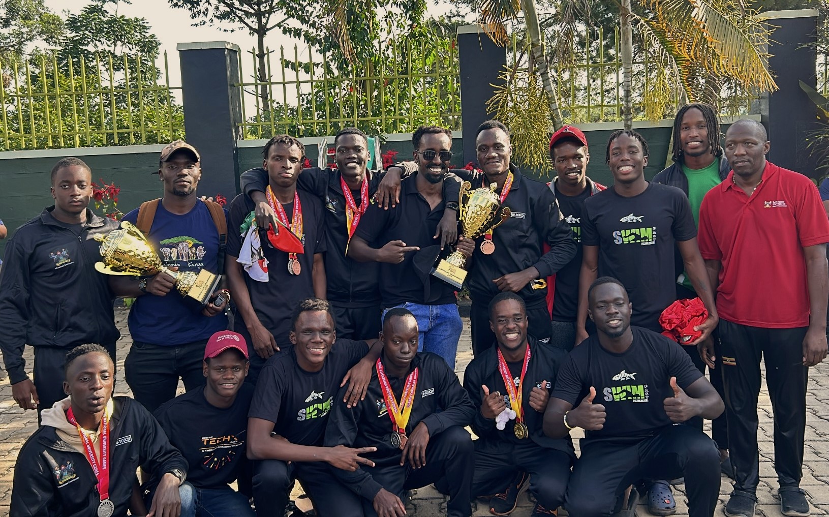 Mak Sharks Men with Head Coach Mr. Tamale Thomas at the AUUS 2025 Games at UCU Mukono. Making Waves: The Rise of the Mak Sharks and Makerere University's Aquatic Legacy, Swimming, Kampala Uganda, East Africa.