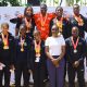 The Dean of Students-Dr. Winifred Kabumbuli (3rd R) and Principal Sports Tutor-Mr. Brian Miiro (R) at the podium with Mak Sharks Team Members that claimed both best overall trophies for the Men and Ladies categories at the AUUS Games in December 2025. Making Waves: The Rise of the Mak Sharks and Makerere University's Aquatic Legacy, Swimming, Kampala Uganda, East Africa.