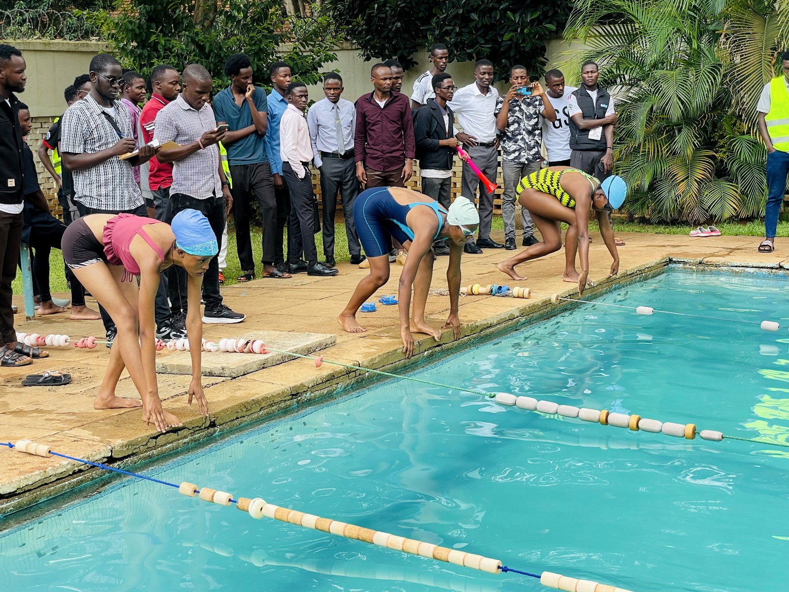 Female swimmers that took part in the College of Natural Sciences (CoNAS) Inter-Association Swimming Gala held 26th March 2026 on their marks at the Makerere Pool. Making Waves: The Rise of the Mak Sharks and Makerere University's Aquatic Legacy, Swimming, Kampala Uganda, East Africa.