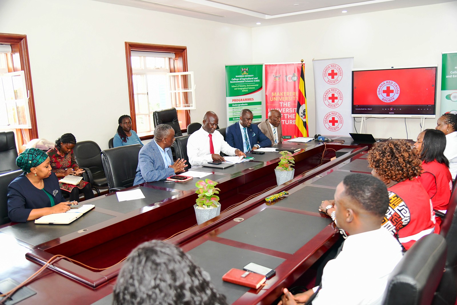 Makerere University and URCS officials during the MoU signing ceremony in the Vice Chancellor's Boardroom at Makerere University. Makerere University and Uganda Red Cross Society (URCS) sign Memorandum of Understanding (MoU) aimed at strengthening collaboration in research, training, innovation, and humanitarian service delivery, 19th May 2026, Main Building, Kampala, East Africa.