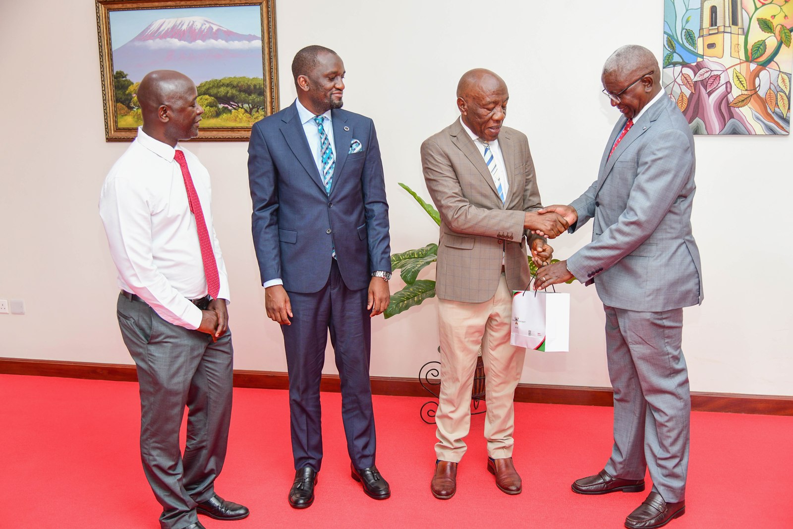 Prof. Alinaitwe presenting souvenirs to Mr. Kwesiga. Makerere University and Uganda Red Cross Society (URCS) sign Memorandum of Understanding (MoU) aimed at strengthening collaboration in research, training, innovation, and humanitarian service delivery, 19th May 2026, Main Building, Kampala, East Africa.