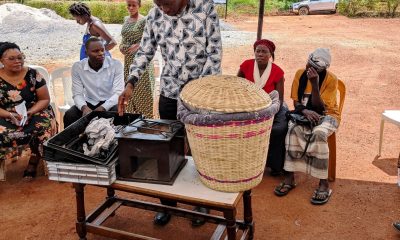Dr. Patrick Musinguzi, the TORCH Project PI, showcasing the Gas Chambers for measuring GHGs emitted from the soil and animal waste, a portable improved energy cooking stove, and a food warming basket. Towards a Clean Energy and Zero-Emission Society in East Africa: Strengthening Academic and Community Collaboration in Outreach, Training, and Research for Green Growth and a Healthy Environment (TORCH) Project Living Lab model project engagement, 4th May 2026 in Kawumu Village, Luwero District Uganda, East Africa with participation from Makerere University, BOKU University (Austria), Kabale University, academia, local communities, civil society, and international institutions.
