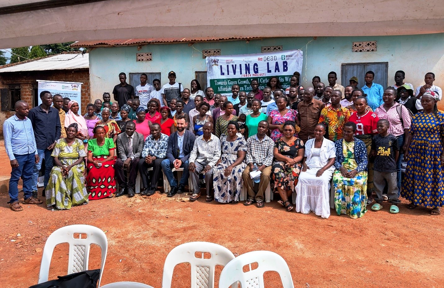 Group photo of all the members who attended the Living Lab community engagement. Towards a Clean Energy and Zero-Emission Society in East Africa: Strengthening Academic and Community Collaboration in Outreach, Training, and Research for Green Growth and a Healthy Environment (TORCH) Project Living Lab model project engagement, 4th May 2026 in Kawumu Village, Luwero District Uganda, East Africa with participation from Makerere University, BOKU University (Austria), Kabale University, academia, local communities, civil society, and international institutions.