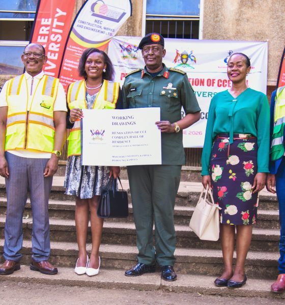 Lt. Gen. James Mugira (3rd R) and Guild President H.E. Kadondi Gracious (3rd L) display a copy of the CCE Complex Working Drawings at the site handover on 26th June 2026 as L-R: Eng. Brian Buhanda, Prof. Barnabas Nawangwe, Dr. Winifred Kabumbuli and Prof. Henry Alinaitwe witness. Vice Chancellor, Prof. Barnabas Nawangwe hands over CCE (Complex) Hall of Residence Site to National Enterprise Corporation (NEC) Managing Director and CEO, Lt. Gen. James Mugira for renovation and overhaul works, Friday, 26th June 2026, Makerere University, Kampala Uganda, East Africa.