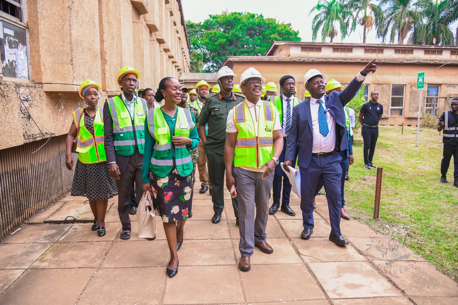Arch. Dr. Kenneth Ssemwogerere (R) leads the team on a guided tour of the site. Vice Chancellor, Prof. Barnabas Nawangwe hands over CCE (Complex) Hall of Residence Site to National Enterprise Corporation (NEC) Managing Director and CEO, Lt. Gen. James Mugira for renovation and overhaul works, Friday, 26th June 2026, Makerere University, Kampala Uganda, East Africa.