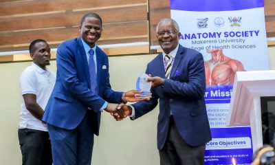 Prof. Elisa Mwaka (L) presents a plaque to keynote speaker, Rev. Prof. Dr. Samuel Luboga at the Second Cadaver Commemoration Ceremony on 11th June 2026. Second Cadaver Commemoration Ceremony organized by the Makerere Students' Anatomy Society under the Department of Anatomy, College of Health Sciences (CHS) on June 11, 2026 at Makerere University School of Public Health Auditorium, Main Campus, Eastern Gate, Kampala Uganda, East Africa.
