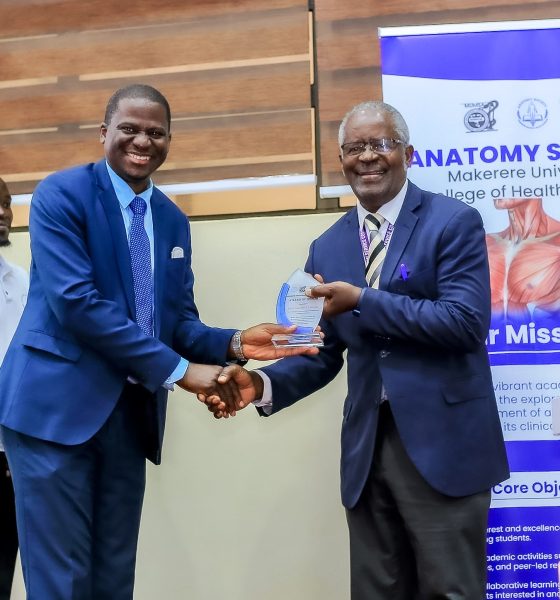 Prof. Elisa Mwaka (L) presents a plaque to keynote speaker, Rev. Prof. Dr. Samuel Luboga at the Second Cadaver Commemoration Ceremony on 11th June 2026. Second Cadaver Commemoration Ceremony organized by the Makerere Students' Anatomy Society under the Department of Anatomy, College of Health Sciences (CHS) on June 11, 2026 at Makerere University School of Public Health Auditorium, Main Campus, Eastern Gate, Kampala Uganda, East Africa.