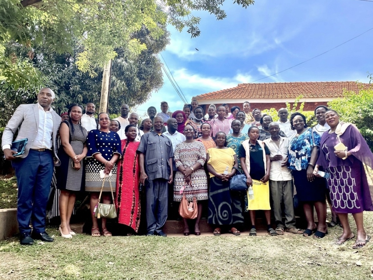 Study participants join Principal Investigator Professor Peter Baguma, members of the research team and officials from the Ministry of Health's Department of Mental Health and Control of Substance Abuse for a group photo after the dissemination workshop on 16th June 2026. Physiology Lecture Theatre at the College of Health Sciences, Mulago Hospital Complex, Makerere University, Kampala Uganda, East Africa.