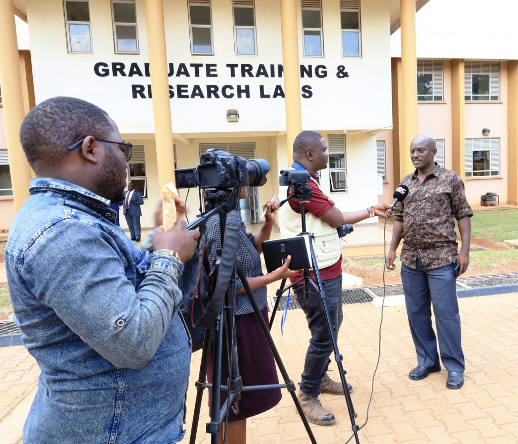 Boaz Tumusiime Mboijjana, one of the graduates speaking to journalists after the ceremony. Makerere University Environment for Development Initiative (EfD- Mak Centre) graduation of five senior government officials under the 2025 Inclusive Green Economy (IGE) Fellowship Programme, equipping them with advanced knowledge and skills to champion climate-smart agriculture (CSA) and sustainable development in Uganda, June 25, 2026, Makerere University Agricultural Research Institute, Kabanyolo (MUARIK), Wakiso, East Africa.
