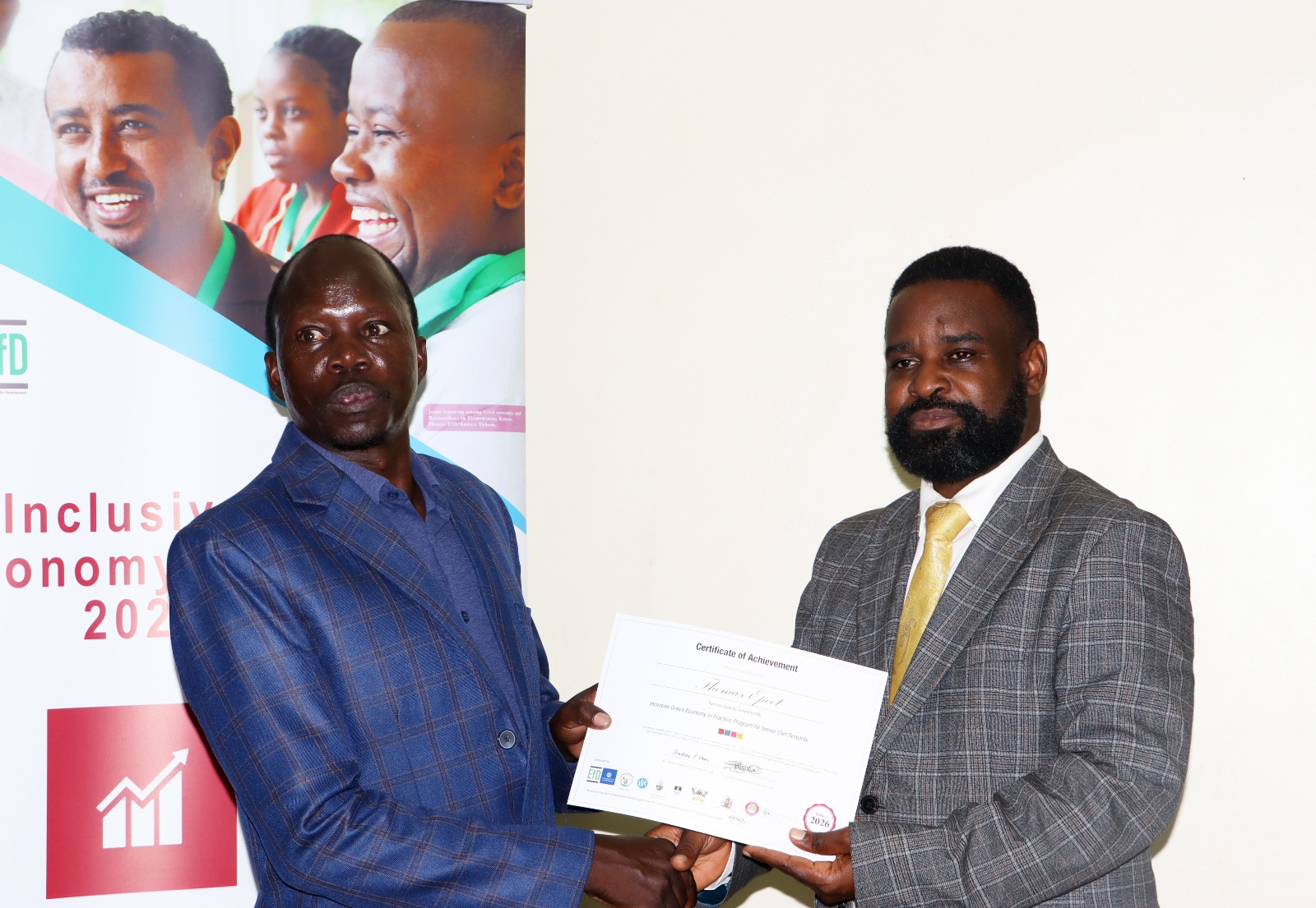 Eng. Epeet Thomas receives his certificate. Makerere University Environment for Development Initiative (EfD- Mak Centre) graduation of five senior government officials under the 2025 Inclusive Green Economy (IGE) Fellowship Programme, equipping them with advanced knowledge and skills to champion climate-smart agriculture (CSA) and sustainable development in Uganda, June 25, 2026, Makerere University Agricultural Research Institute, Kabanyolo (MUARIK), Wakiso, East Africa.