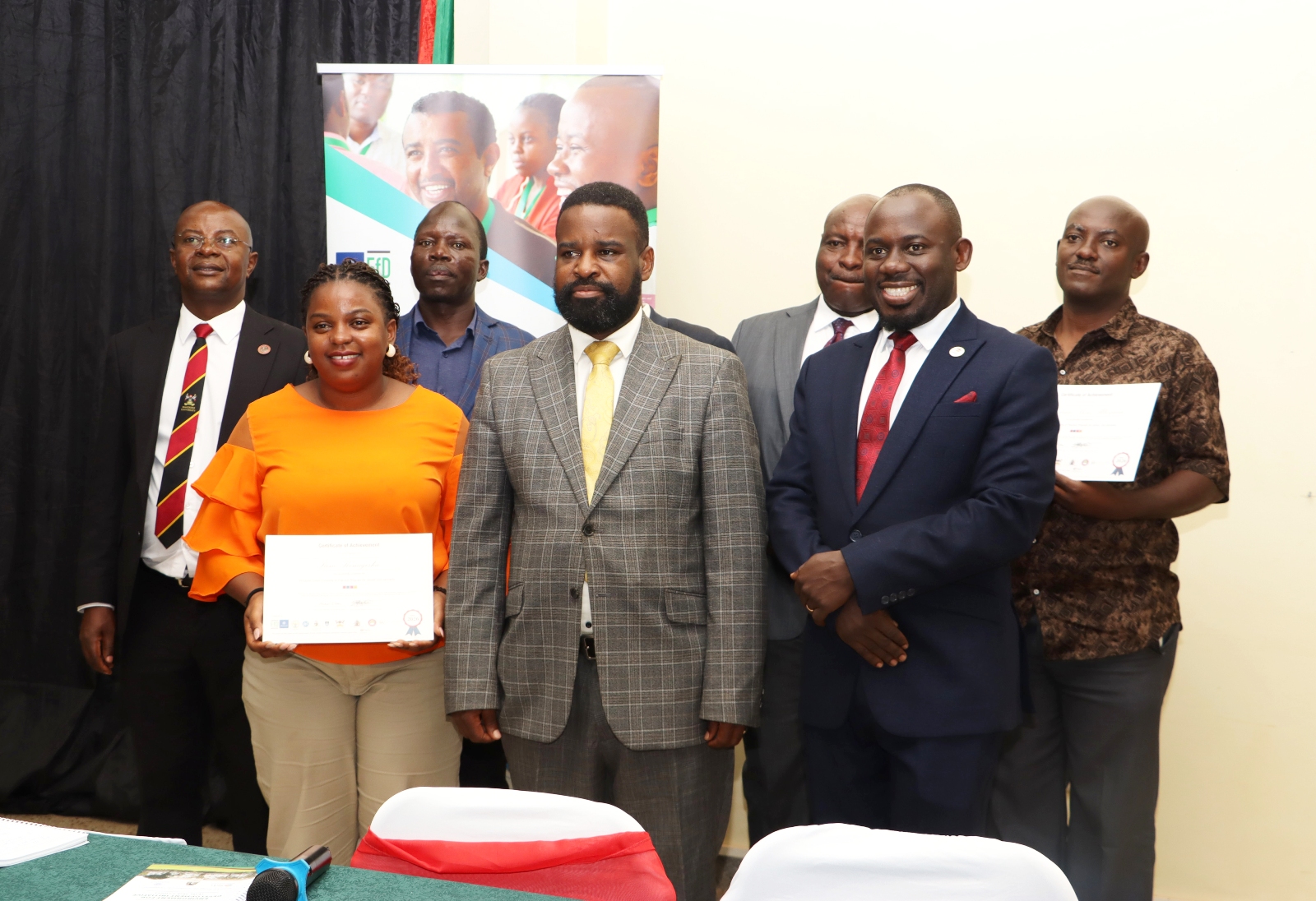 Graduates pose for a photo with the representative of the VC. Prof. Robert Wamala and Dr. Peter Babyenda after receiving their certificates. Makerere University Environment for Development Initiative (EfD- Mak Centre) graduation of five senior government officials under the 2025 Inclusive Green Economy (IGE) Fellowship Programme, equipping them with advanced knowledge and skills to champion climate-smart agriculture (CSA) and sustainable development in Uganda, June 25, 2026, Makerere University Agricultural Research Institute, Kabanyolo (MUARIK), Wakiso, East Africa.