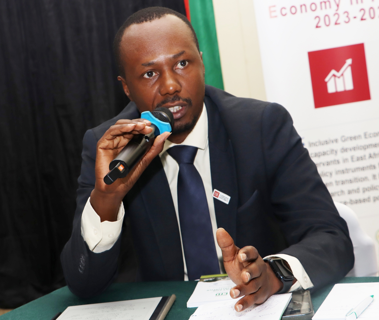 Wilson Asiimwe from the Ministry of Finance, Planning and Economic Development presenting during the panel discussion. Makerere University Environment for Development Initiative (EfD- Mak Centre) graduation of five senior government officials under the 2025 Inclusive Green Economy (IGE) Fellowship Programme, equipping them with advanced knowledge and skills to champion climate-smart agriculture (CSA) and sustainable development in Uganda, June 25, 2026, Makerere University Agricultural Research Institute, Kabanyolo (MUARIK), Wakiso, East Africa.