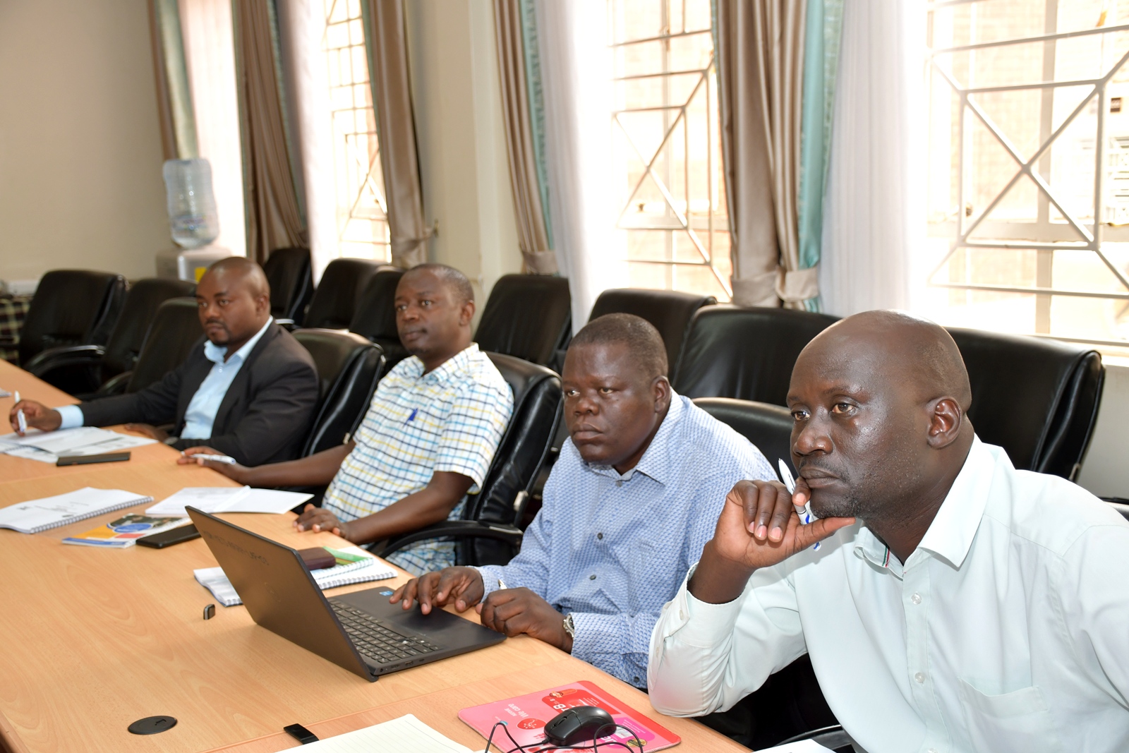 A section of participants follows proceedings. Makerere University’s Public Investment Management (PIM) Centre of Excellence commencement of three-day Essential Public Investment Management Training Programme aimed at strengthening the capacity of government officials in project preparation, appraisal, and implementation. Supported by the Ministry of Finance, Planning and Economic Development, 2nd June 2026, College of Business and Management Sciences (CoBAMS), Kampala Uganda, East Africa.
