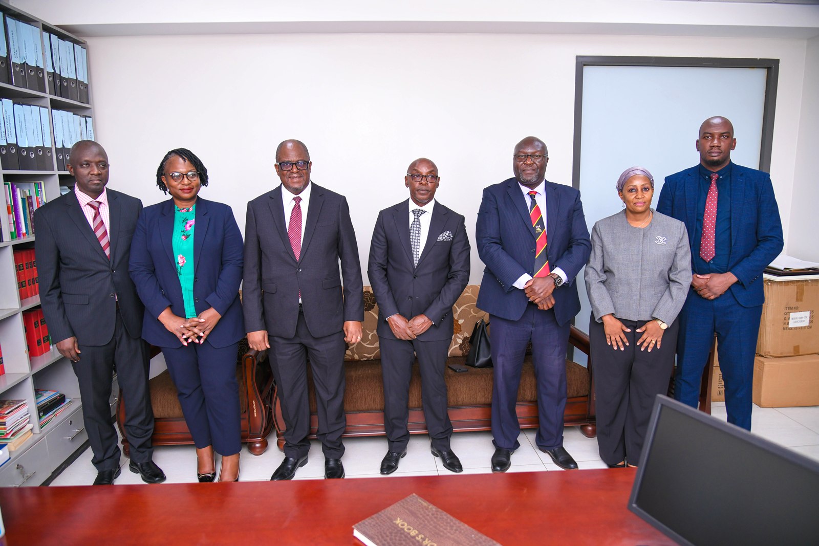 Hon. Justice Dr. Malila (3rd L) and Hon. Justice Dr. Zeija (C) during the courtesy call on the Dean SoL-Prof. Ronald Naluwairo (3rd R) in the company of Deputy Dean SoL-Dr. Zahara Nampewo (2nd R), Executive	Director, Judiciary Training Institute (JTI)-Hon.	Justice Prof. Andrew Khaukha (L) and other officials. Courtesy Visit of the Chief Justice of the Republic of Zambia, Hon. Justice Dr. Mumba Malila and the Chief Justice of Uganda, Hon. Justice Dr. Flavian Zeija on sidelines of the African Chief Justices' Forum on Alternative Dispute Resolution (ADR) leadership handover ceremony, 16th June 2026, Makerere University, Kampala Uganda.