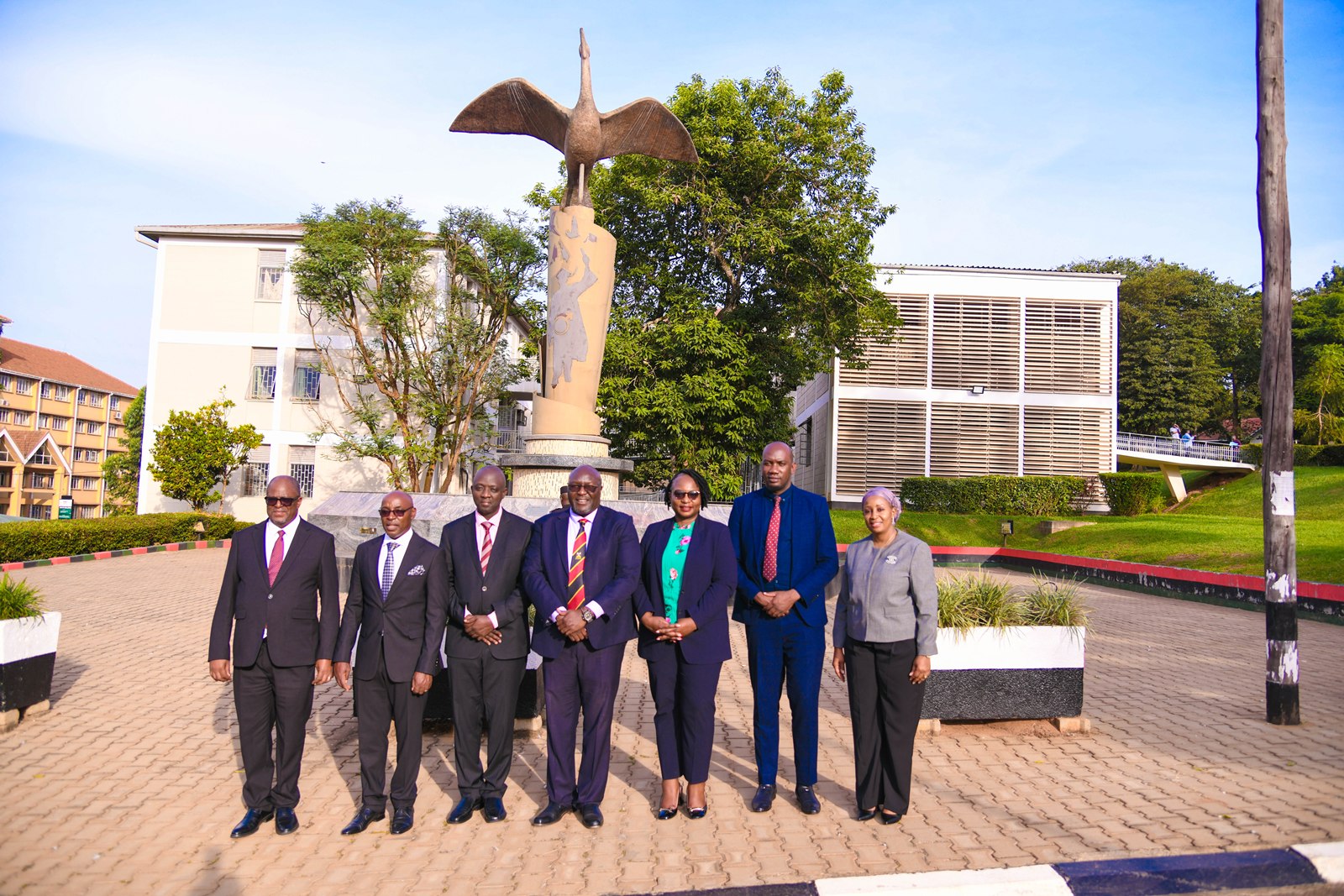 The dignitaries pose for a group photo at the Makerere@100 Monument. Courtesy Visit of the Chief Justice of the Republic of Zambia, Hon. Justice Dr. Mumba Malila and the Chief Justice of Uganda, Hon. Justice Dr. Flavian Zeija on sidelines of the African Chief Justices' Forum on Alternative Dispute Resolution (ADR) leadership handover ceremony, 16th June 2026, Makerere University, Kampala Uganda.