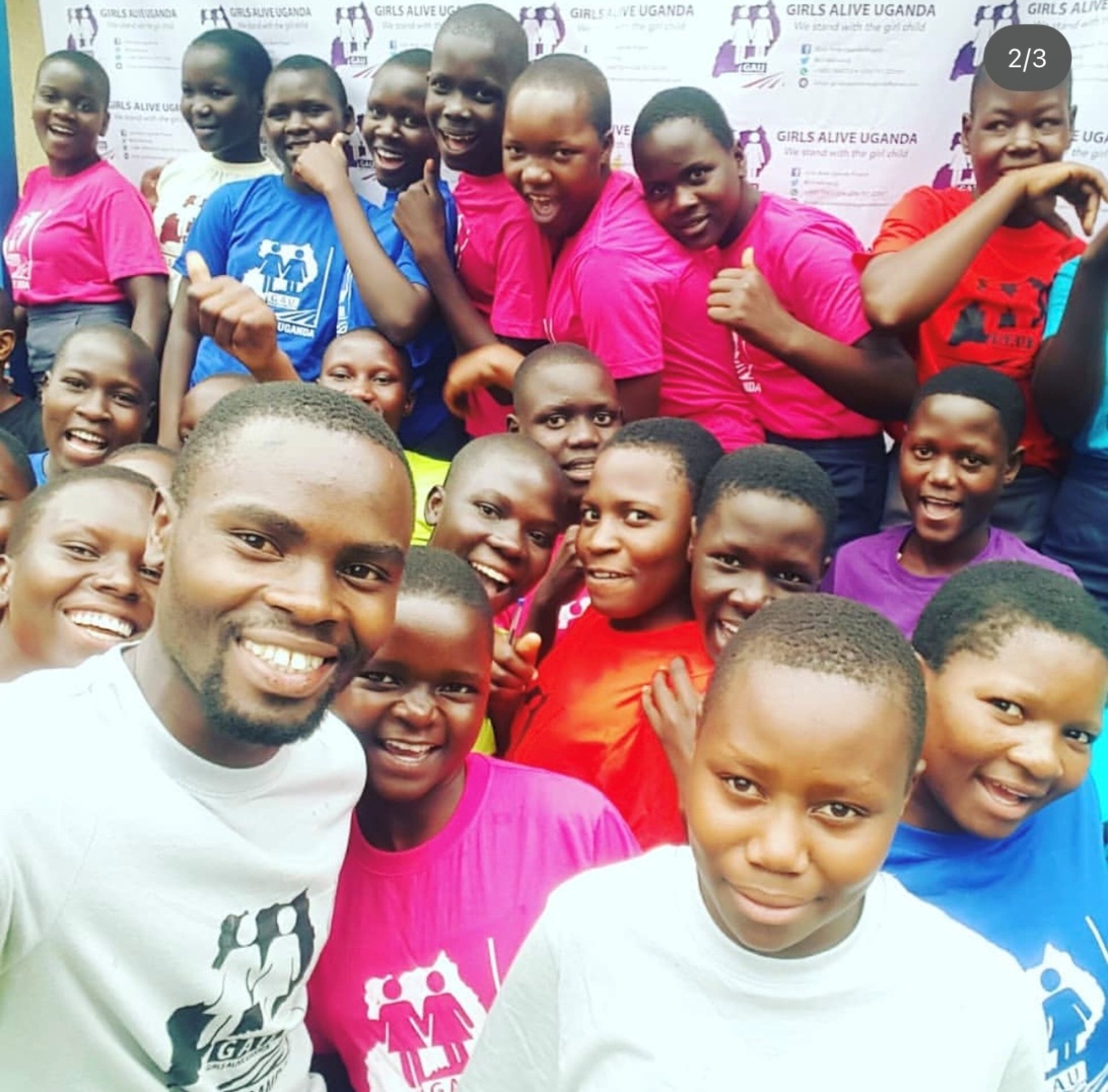 Sylas with some of the Girls Alive Uganda (GAU) beneficiaries.