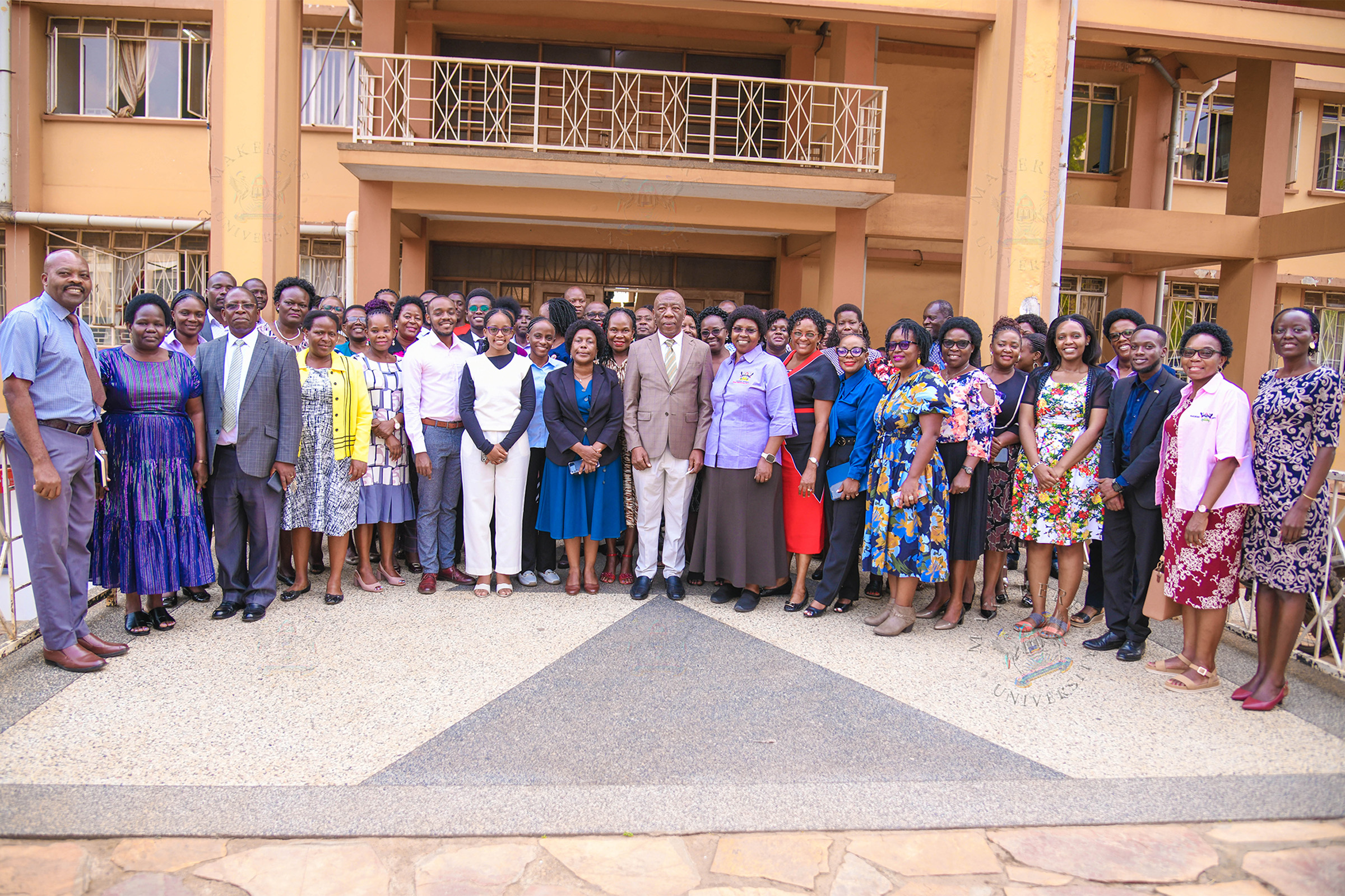 Members of the Vice Chancellor's Roster of 100 in a group photo with Deputy Vice Chancellor (F&A) Prof. Henry Alinaitwe